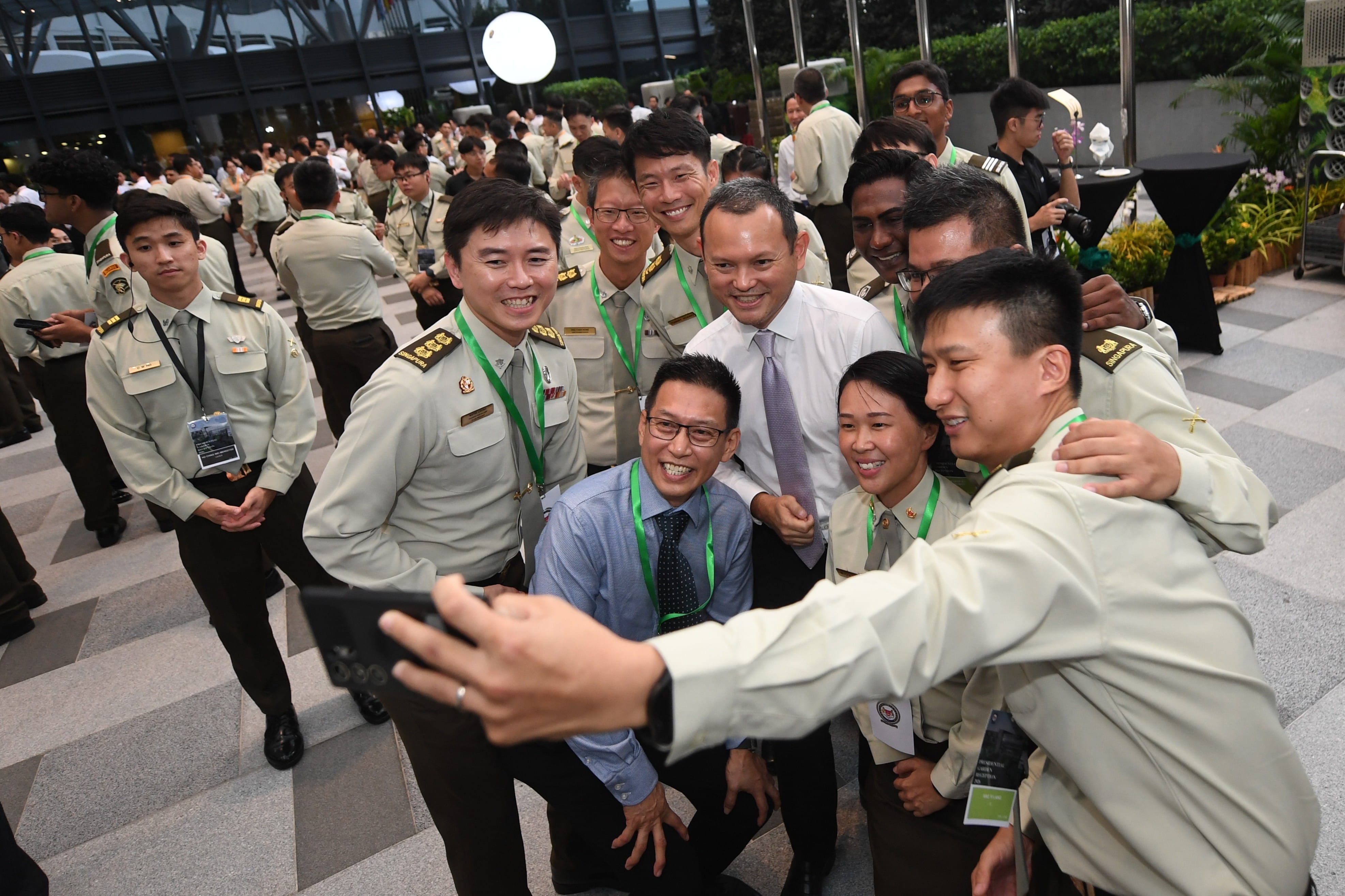 Senior Minister of State for Defence Mr Zaqy Mohamad interacting with service personnel from the Singapore Army.